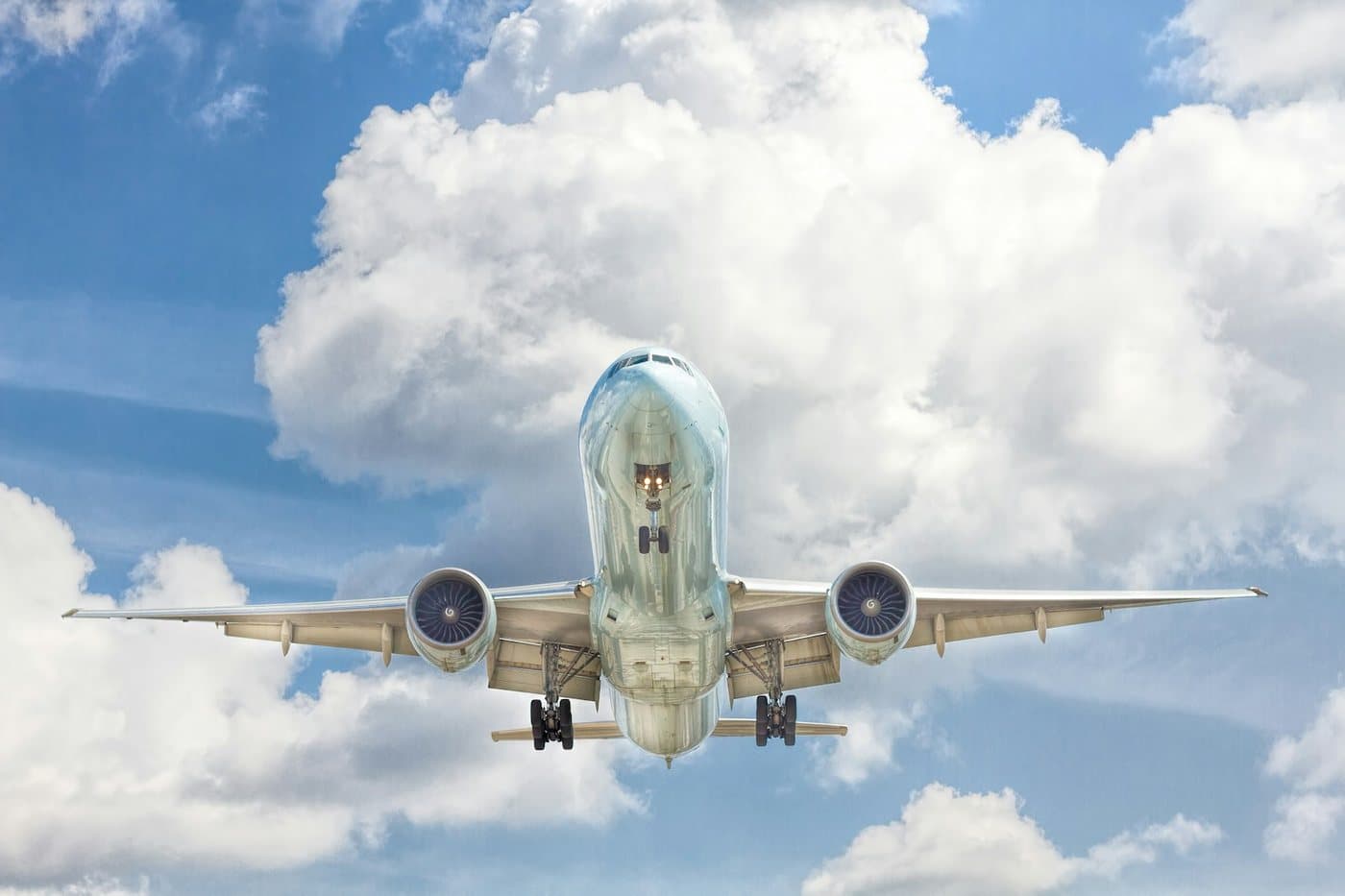 Passenger aircraft flying among clouds
